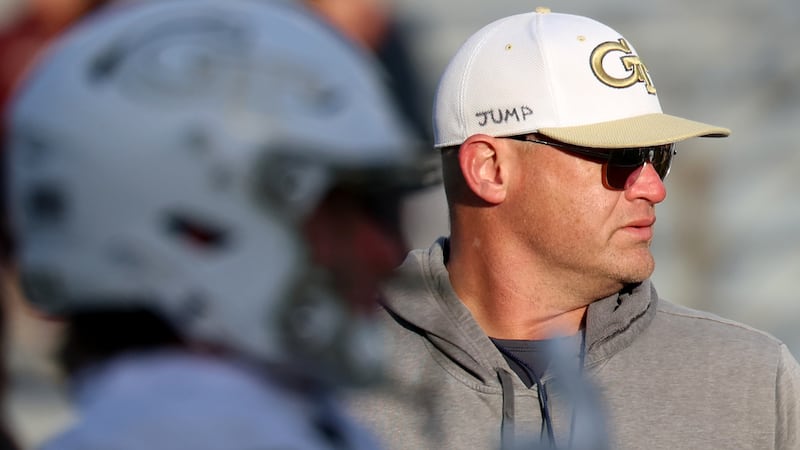 Georgia Tech head coach Brent Key watches during warm-ups before an NCAA college football game...