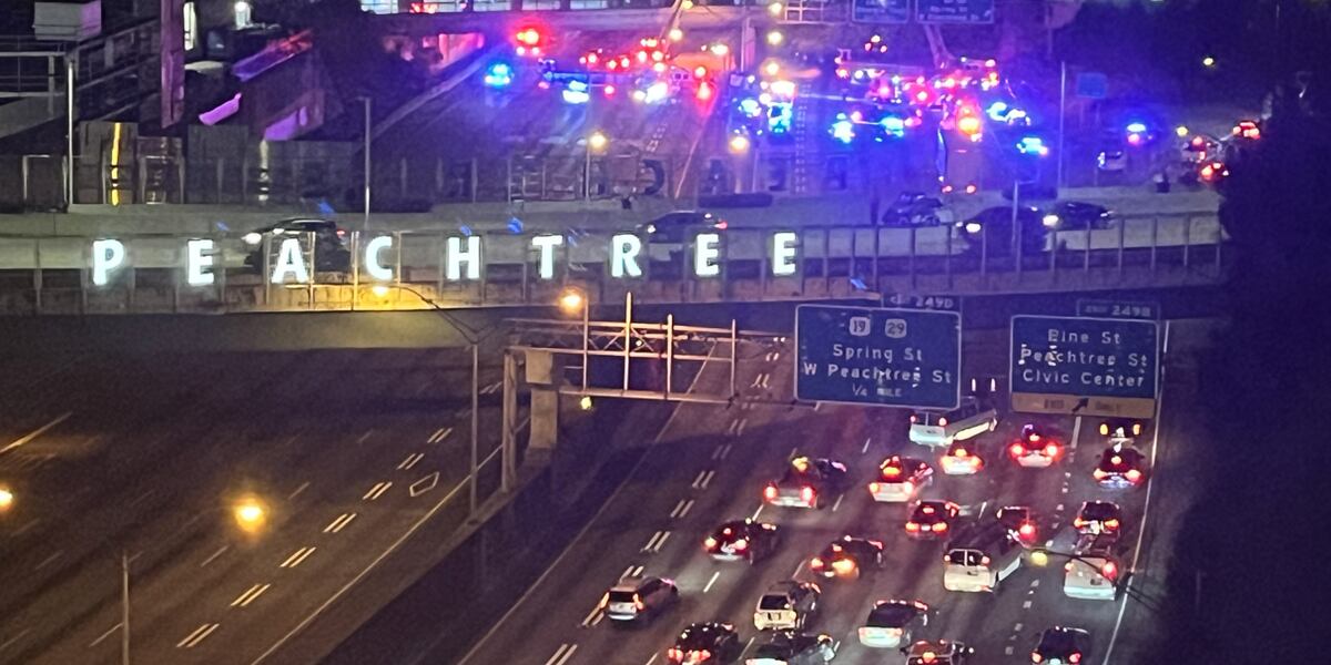 Traffic moving again on Downtown Connector after man stopped from jumping, police say Traffic moving again on Downtown Connector after man stopped from jumping, police say