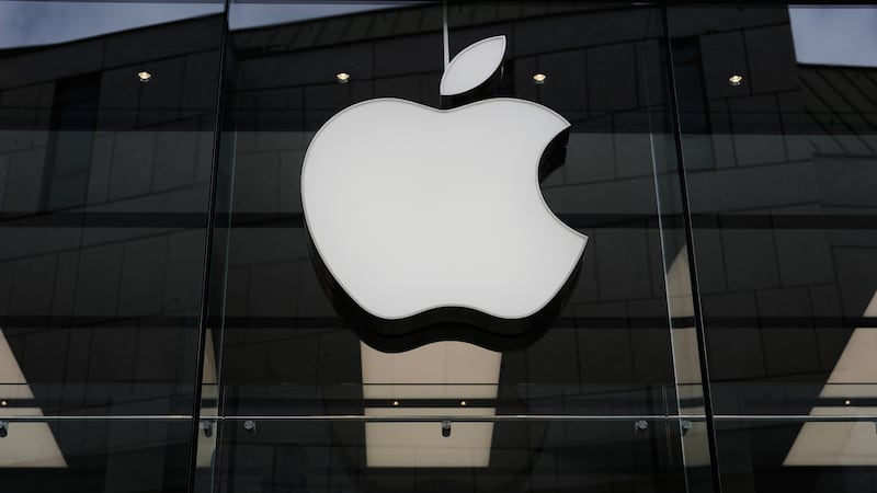 FILE - The Apple logo is illuminated at a store in Munich, April 2, 2026.