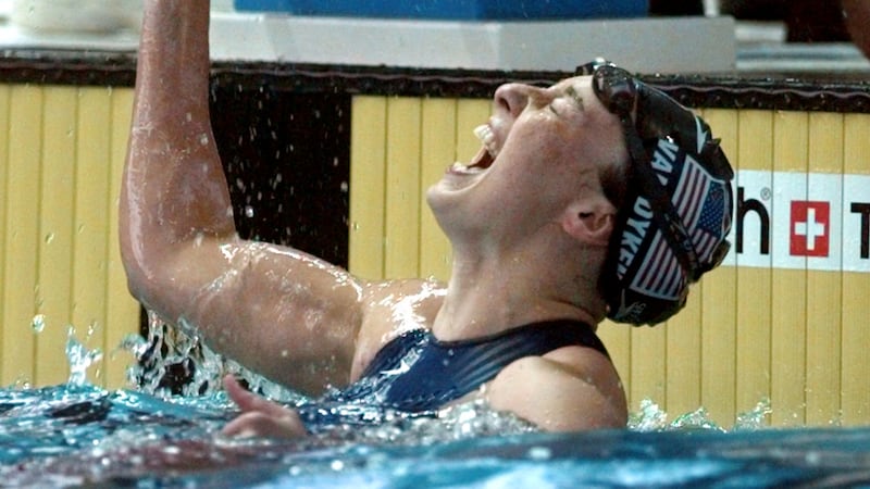 FILE - In this July 26, 1996 file photo, Amy Van Dyken of the United States celebrates after...