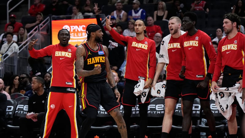 Atlanta Hawks guard Nickeil Alexander-Walker (7) celebrates with teammates after making a shot...