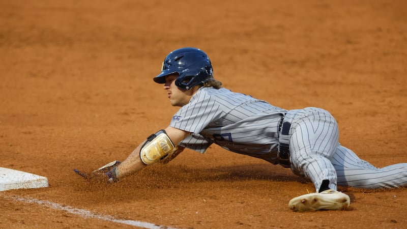 Georgia Tech's Drew Burress (8) slide safely into third base during an NCAA regional baseball...