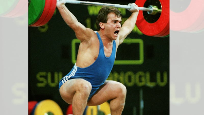 Naim Suleymanoglu, a Turkish hero known as Pocket Hercules, lifts 335kg Monday, July 22, 1996...