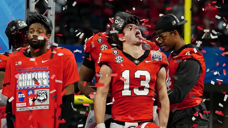 Georgia quarterback Stetson Bennett celebrates after the Peach Bowl NCAA college football...