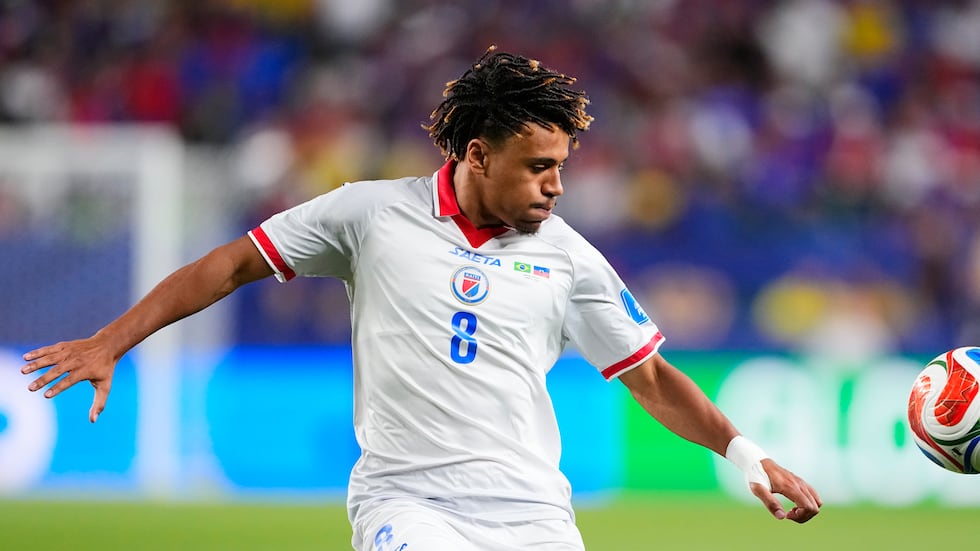 Haiti's Martin Experience (8) controls the ball during the World Cup Group C soccer match...