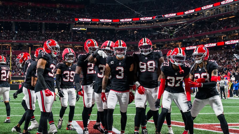 Atlanta Falcons safety Jessie Bates III (3) celebrates an interception return for a touchdown...