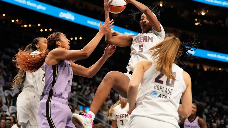 Atlanta Dream forward Angel Reese (5) rebounds the ball against Golden State Valkyries center...