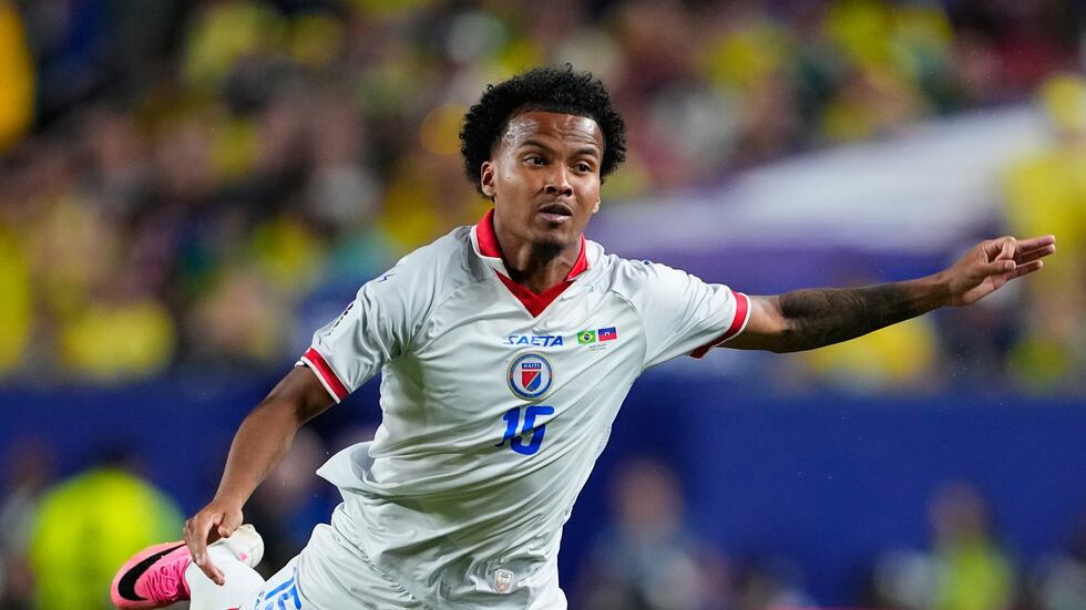 Haiti's Ruben Providence (15) eyes the ball during the World Cup Group C soccer match between...
