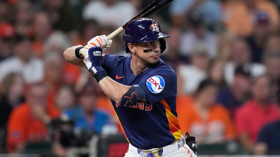 Houston Astros' Mauricio Dubon bats against the Seattle Mariners during the third inning of a...