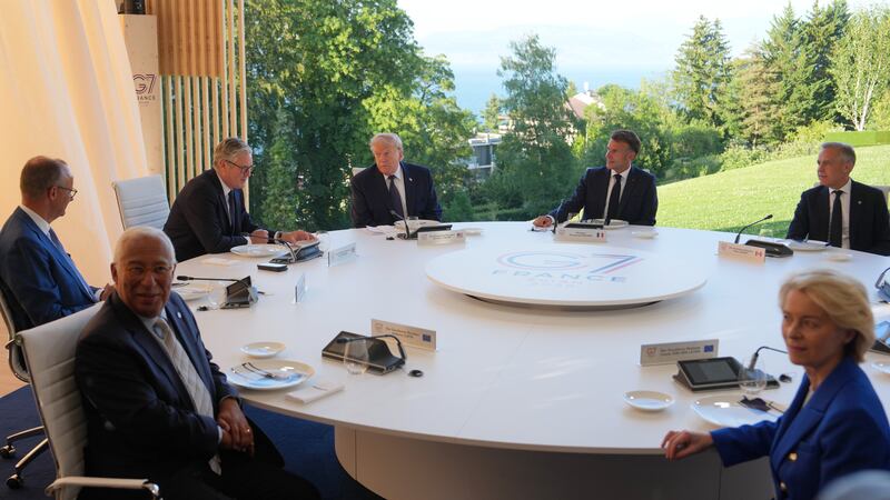 FILE - U.S. President Donald Trump and France's President Emmanuel Macron meet at the G7...