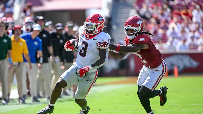 Georgia running back Nate Frazier (3) tries to get away from Arkansas defensive back Shelton...