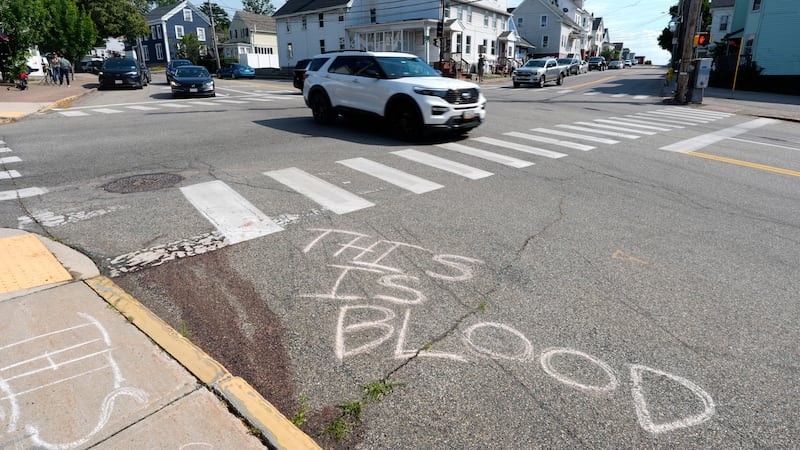 Blood is seen on the pavement near the scene of a shooting involving U.S. Immigration and...