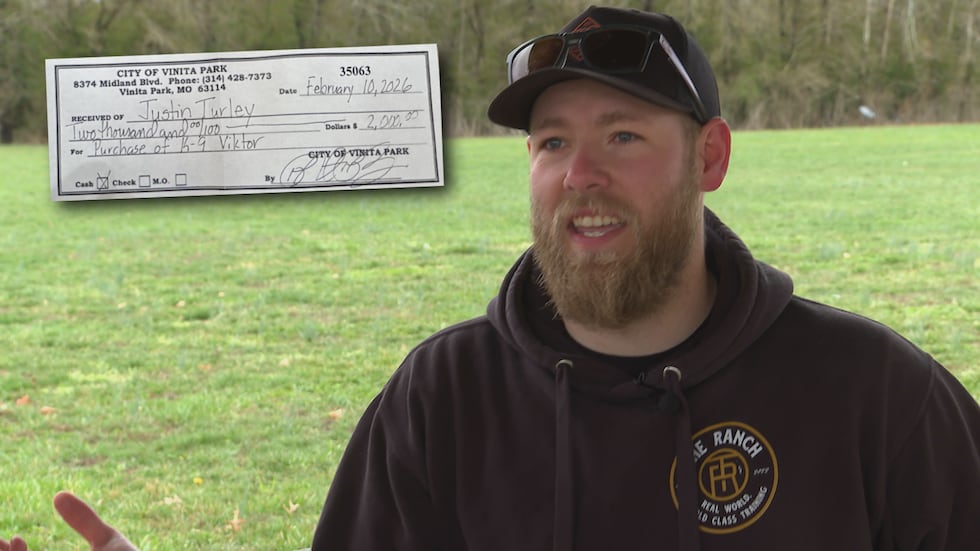 Former NCPC K-9 handler Justin Turley with the receipt for his payment for Viktor.